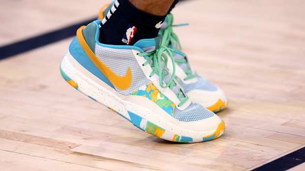 View of Ja Morant's blue and yellow Nike shoes.